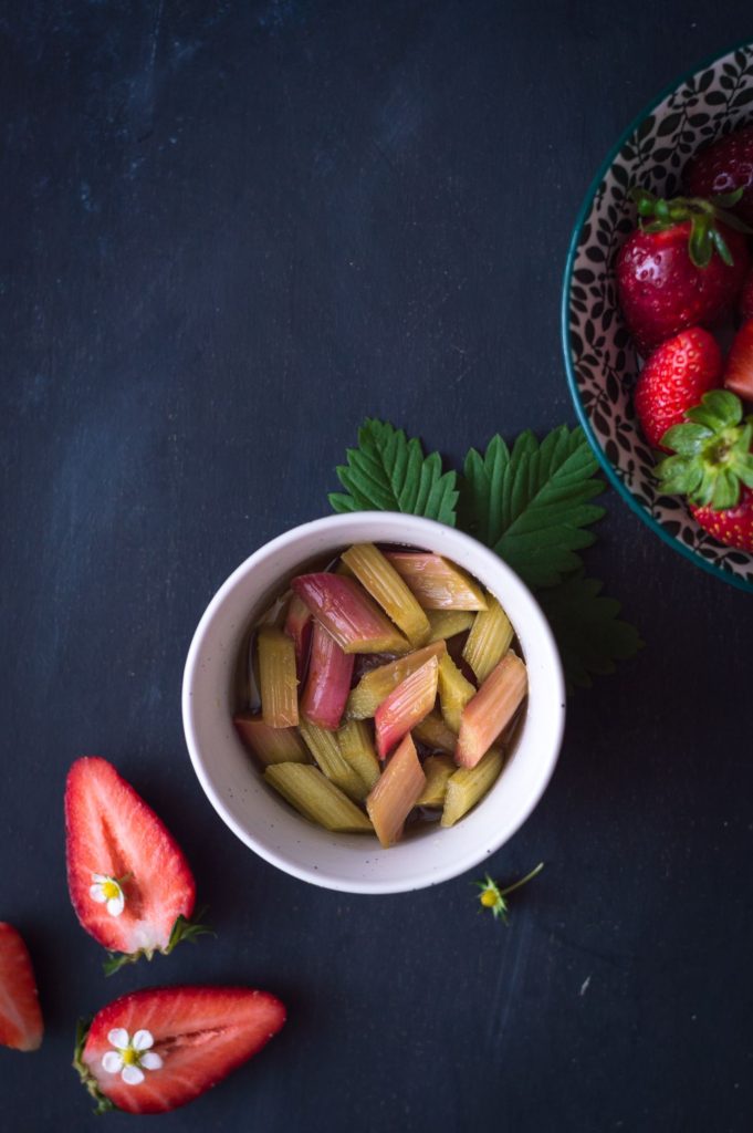 rhubarb in honey syrup and strawberries