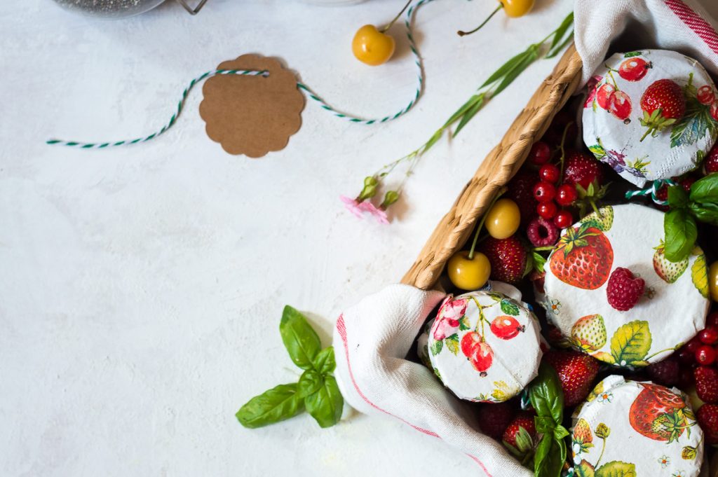 Homemade chia jam in basket full of fruits