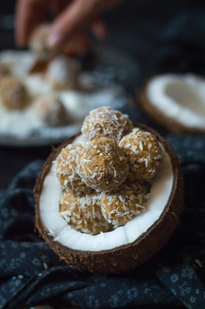 Raw coconut energy balls in halved coconut (copycat Raffaello)