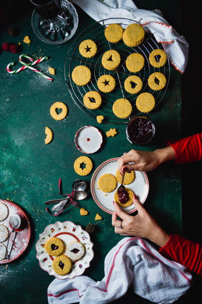 woman making linzer cookies