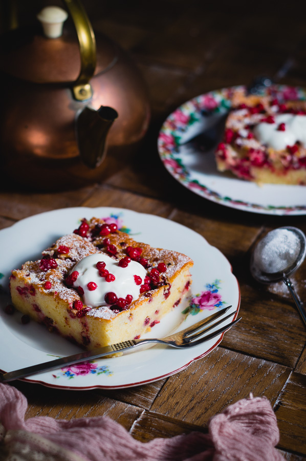 Slices of no measure yogurt cake served with some greek yogurt