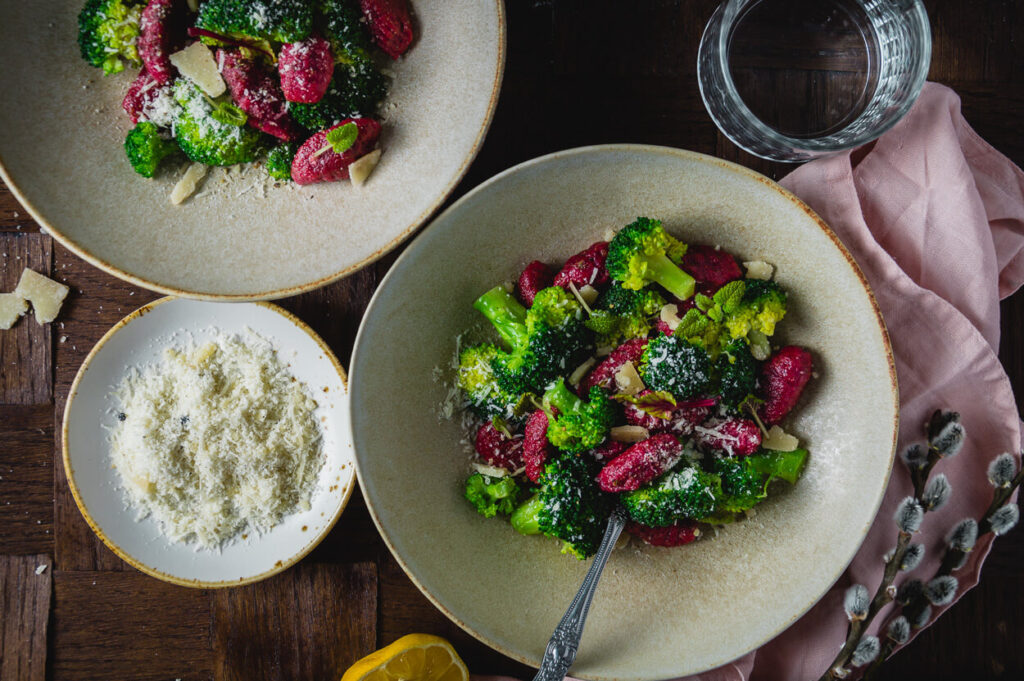 beetroot gnocchi in brown butter sauce with broccoli