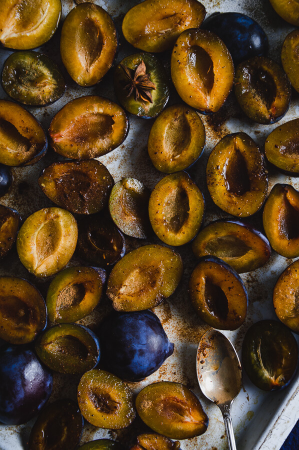 blue damson plums, halved, mixed with spices and dessert wine