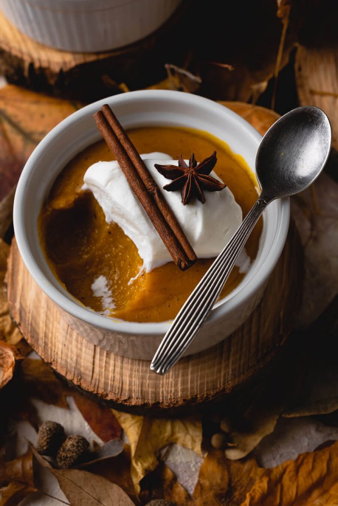 vegan pumpkin pudding served in white ramekin