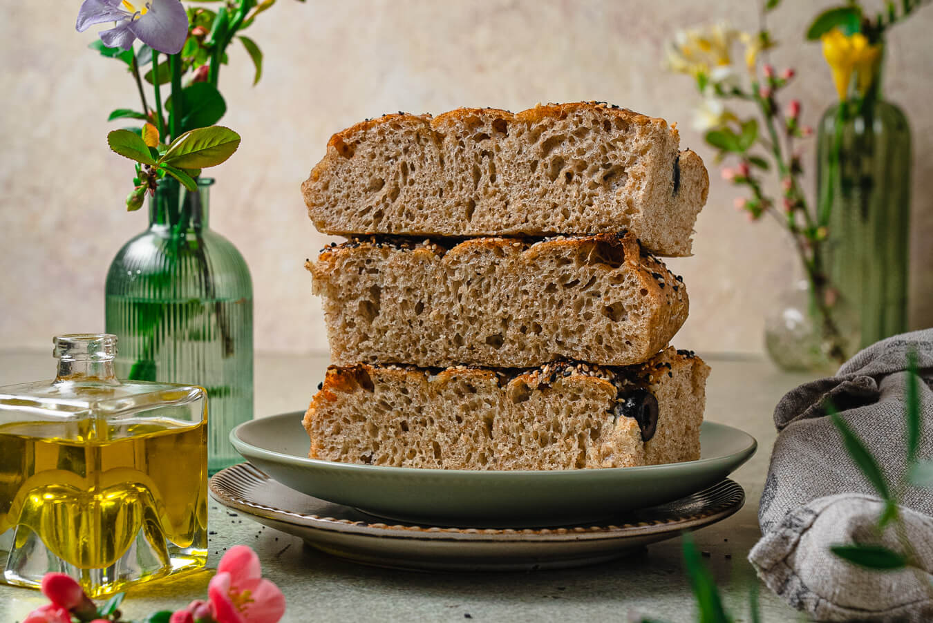 slices of whole wheat focaccia stacked on plate