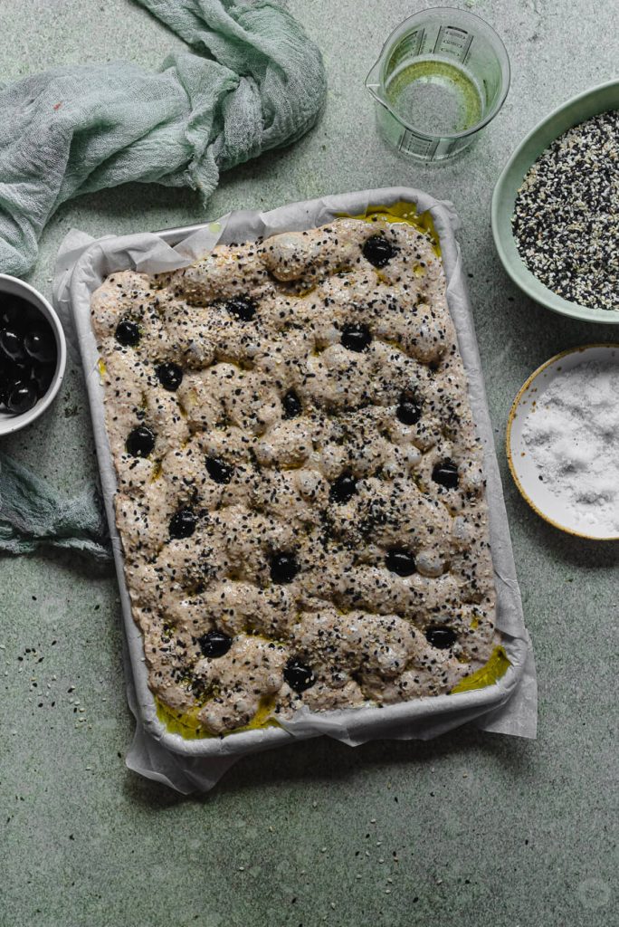 whole wheat focaccia with sesame seeds and black olives