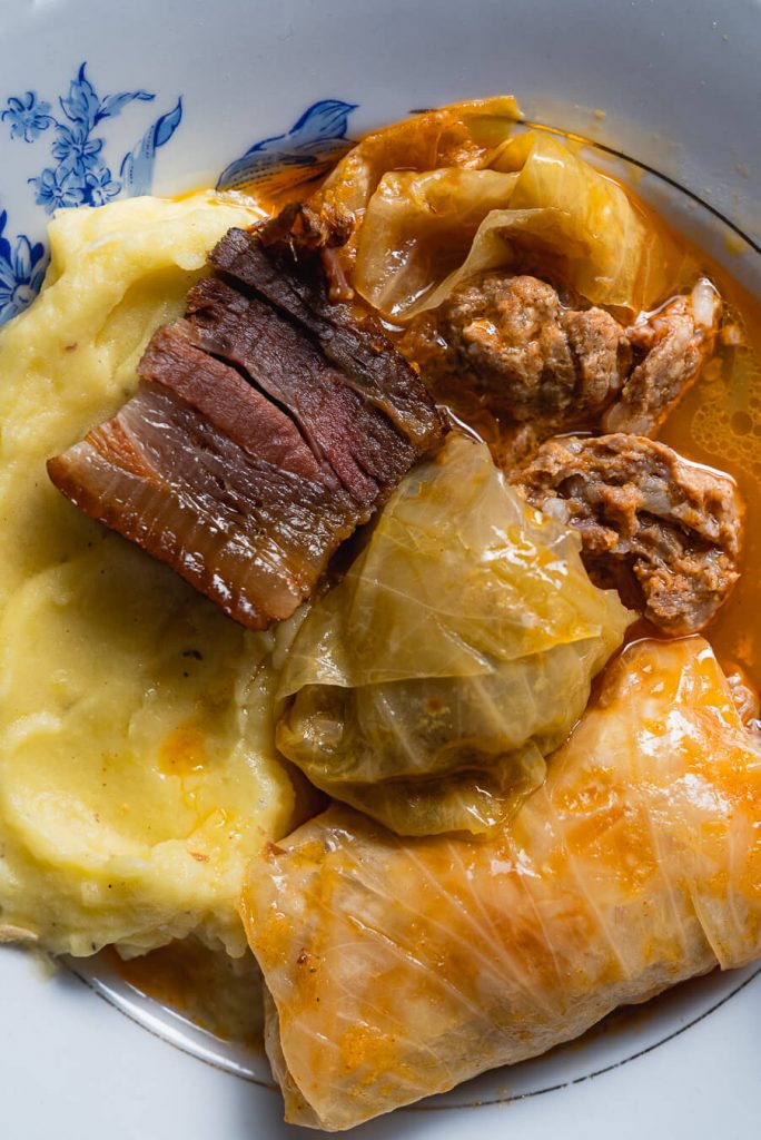 close up of sarma cabbage rolls served with mashed potatoes