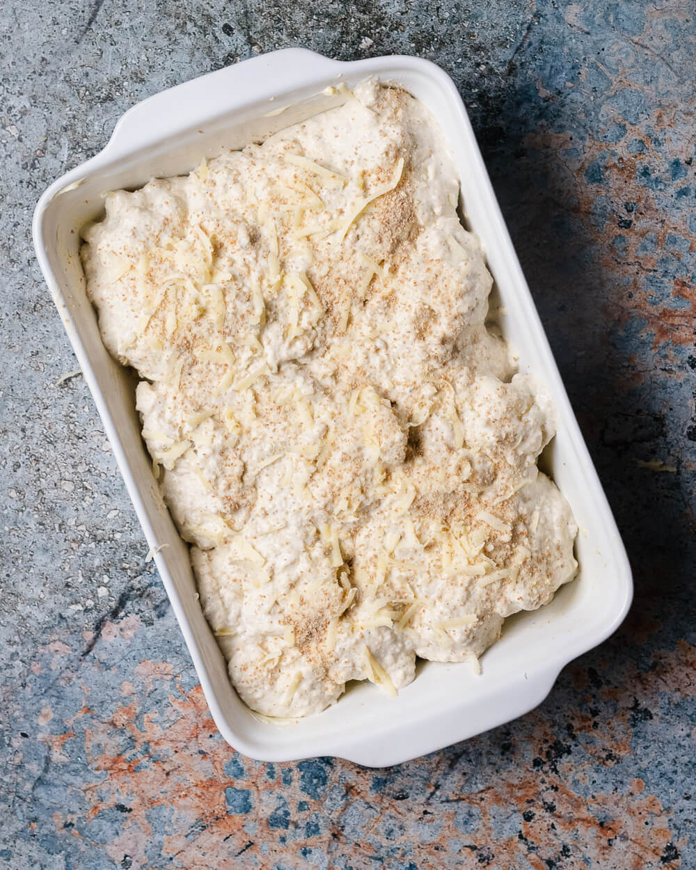 cheesy cauliflower with breadcrumbs ready for roasting in the oven