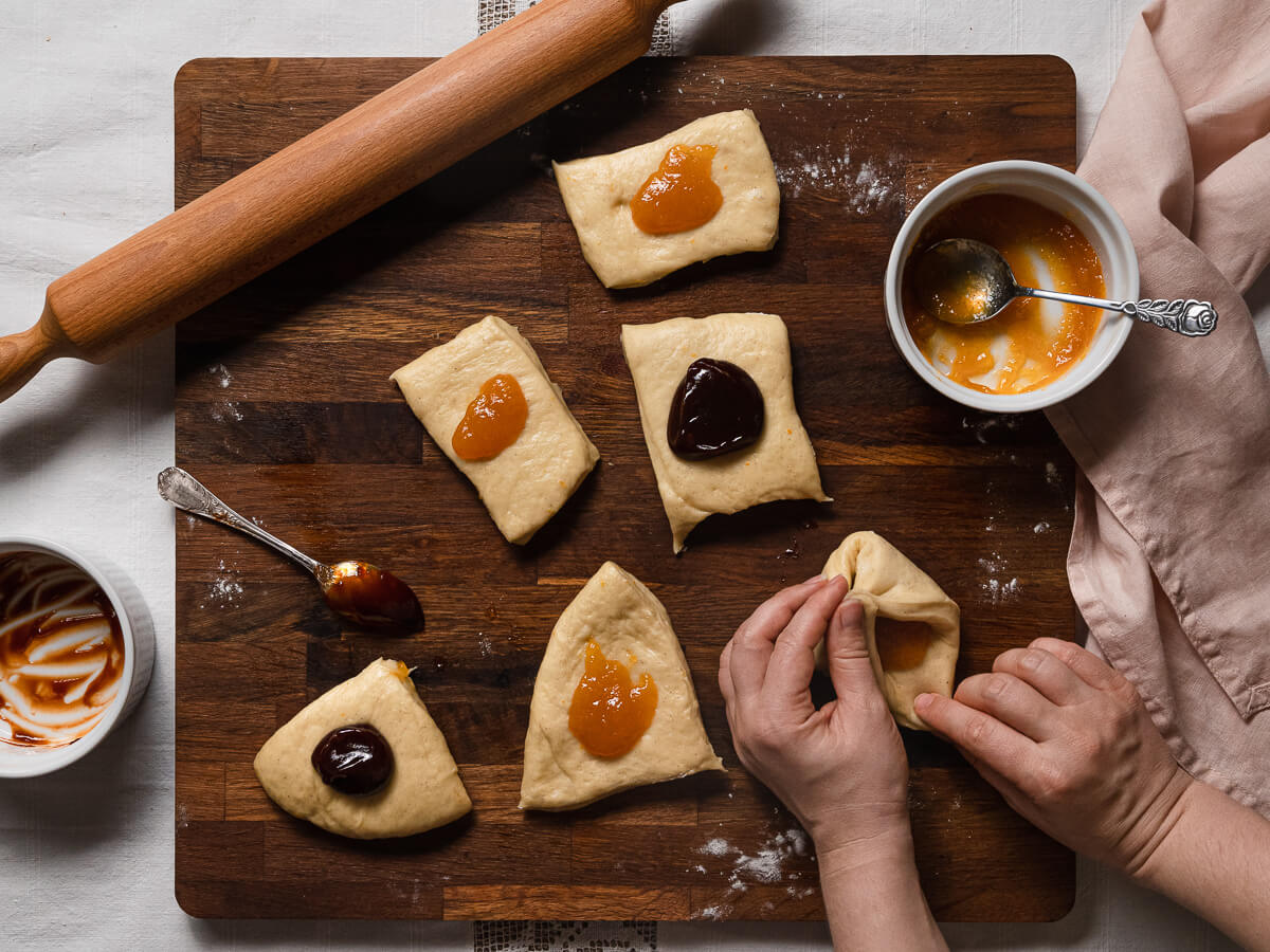 preparing the dough for jam filled buns 