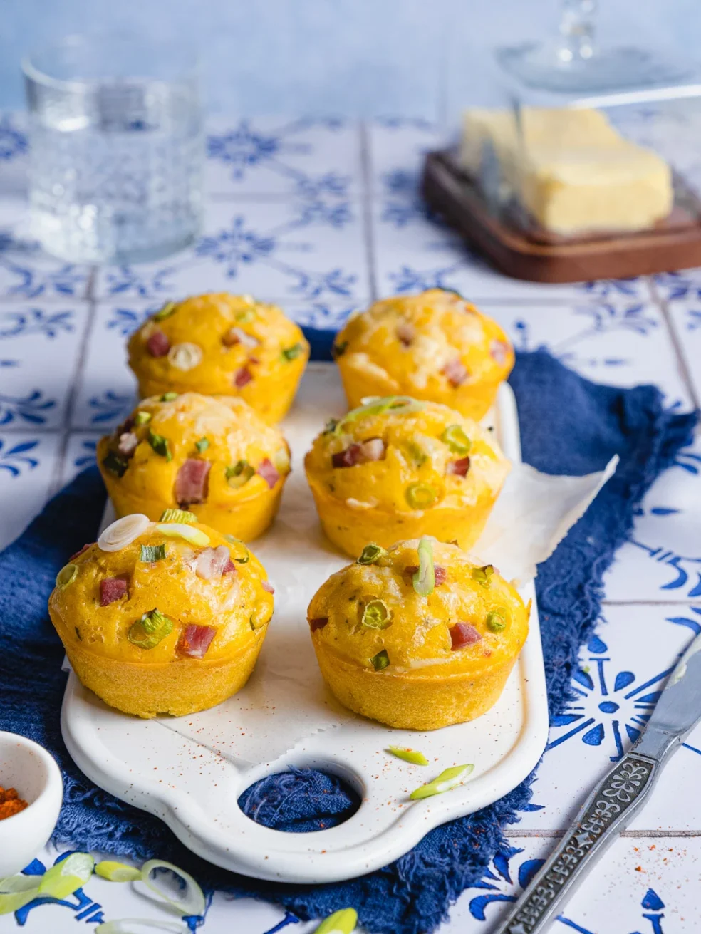 ham and cheese cornbread muffins on white ceramic board