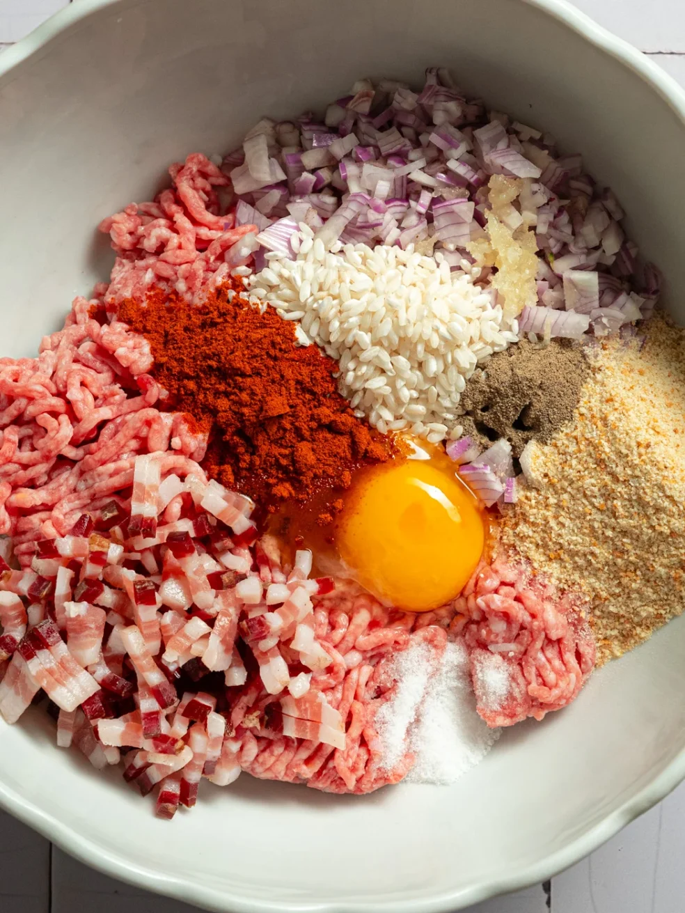 all ingredients for making croatian stuffed peppers, added to a big bowl