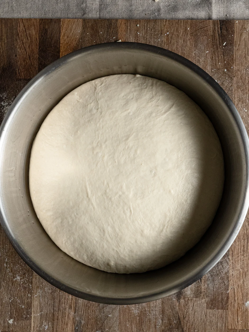 proofed bread dough in a bowl