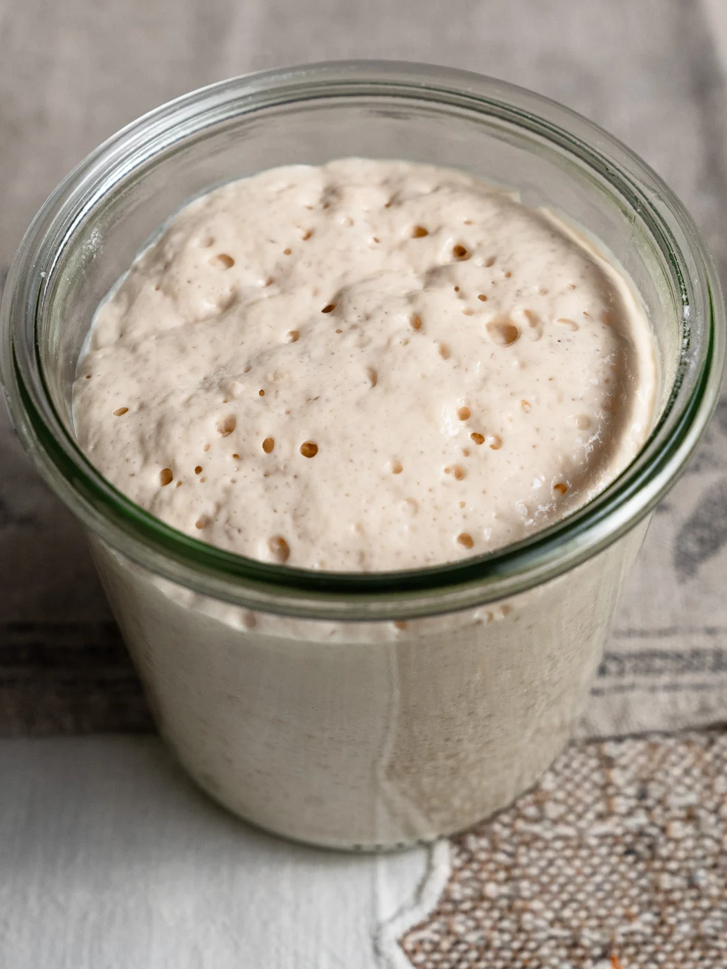 activated yeast in a glass jar, full of bubbles