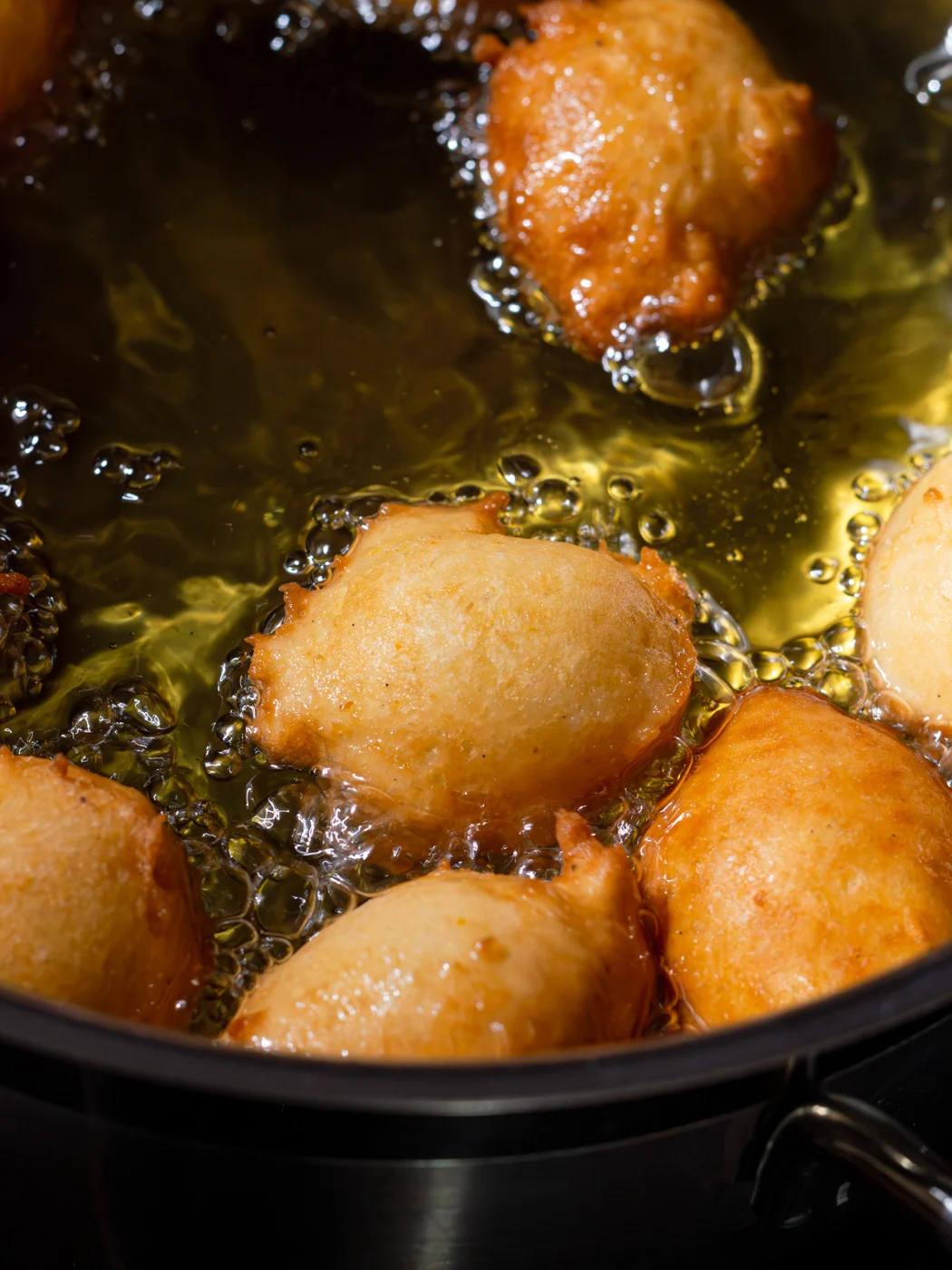 frying croatian fritule in hot oil