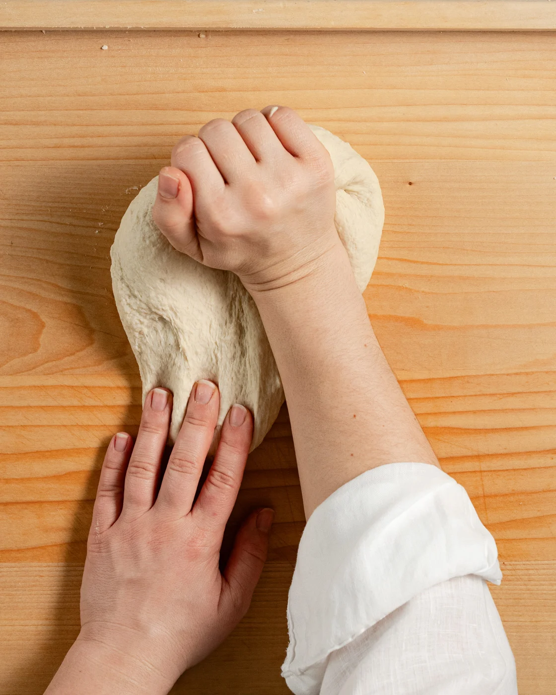 kneading the dough by hands, for making flour tortillas