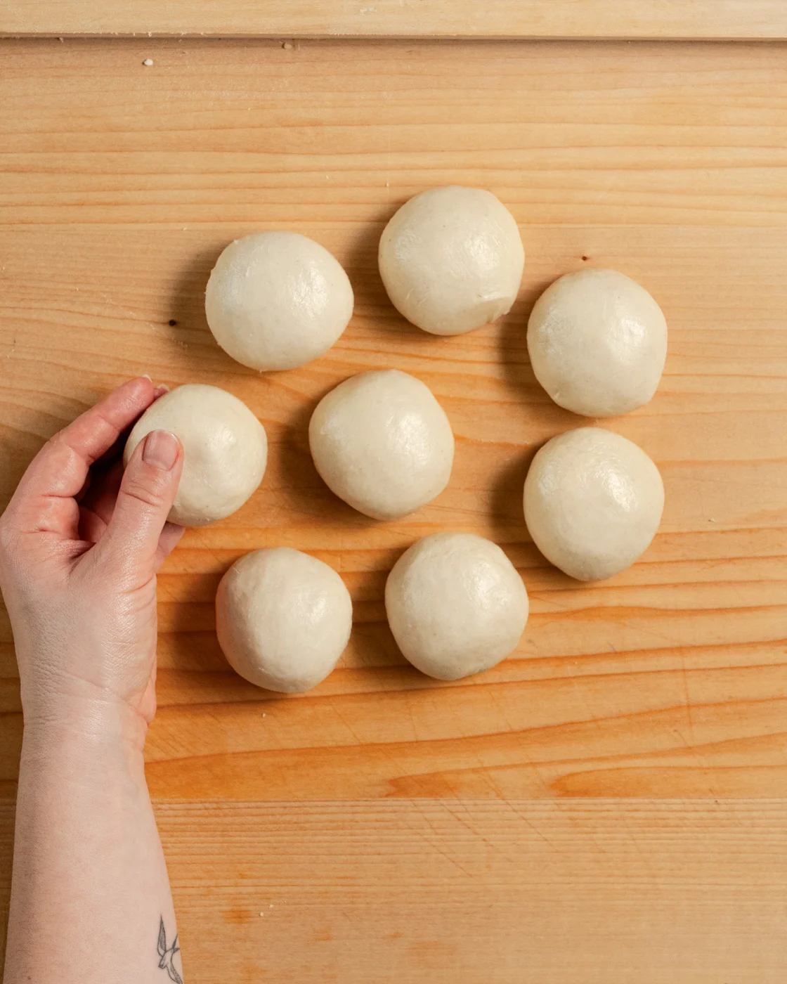 flour tortilla dough divided into 8 pieces