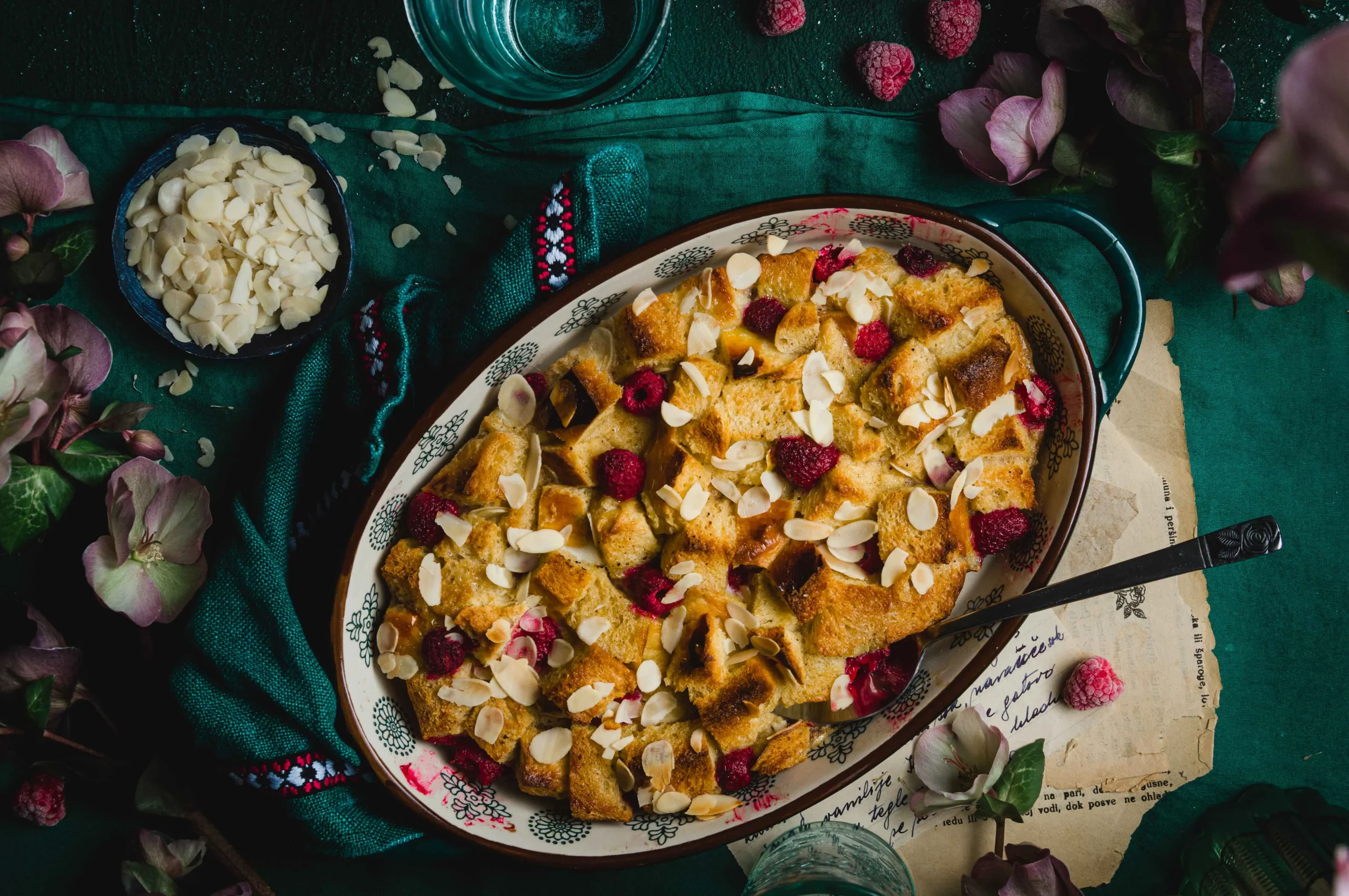 Easter bread pudding made with almond flakes, pinca bread an frozen raspberries