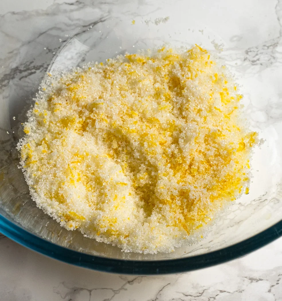 rubbing lemon zest with sugar