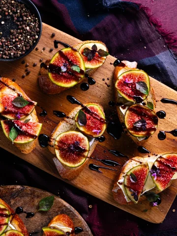 fig and brie crostini, drizled with balsamic glaze