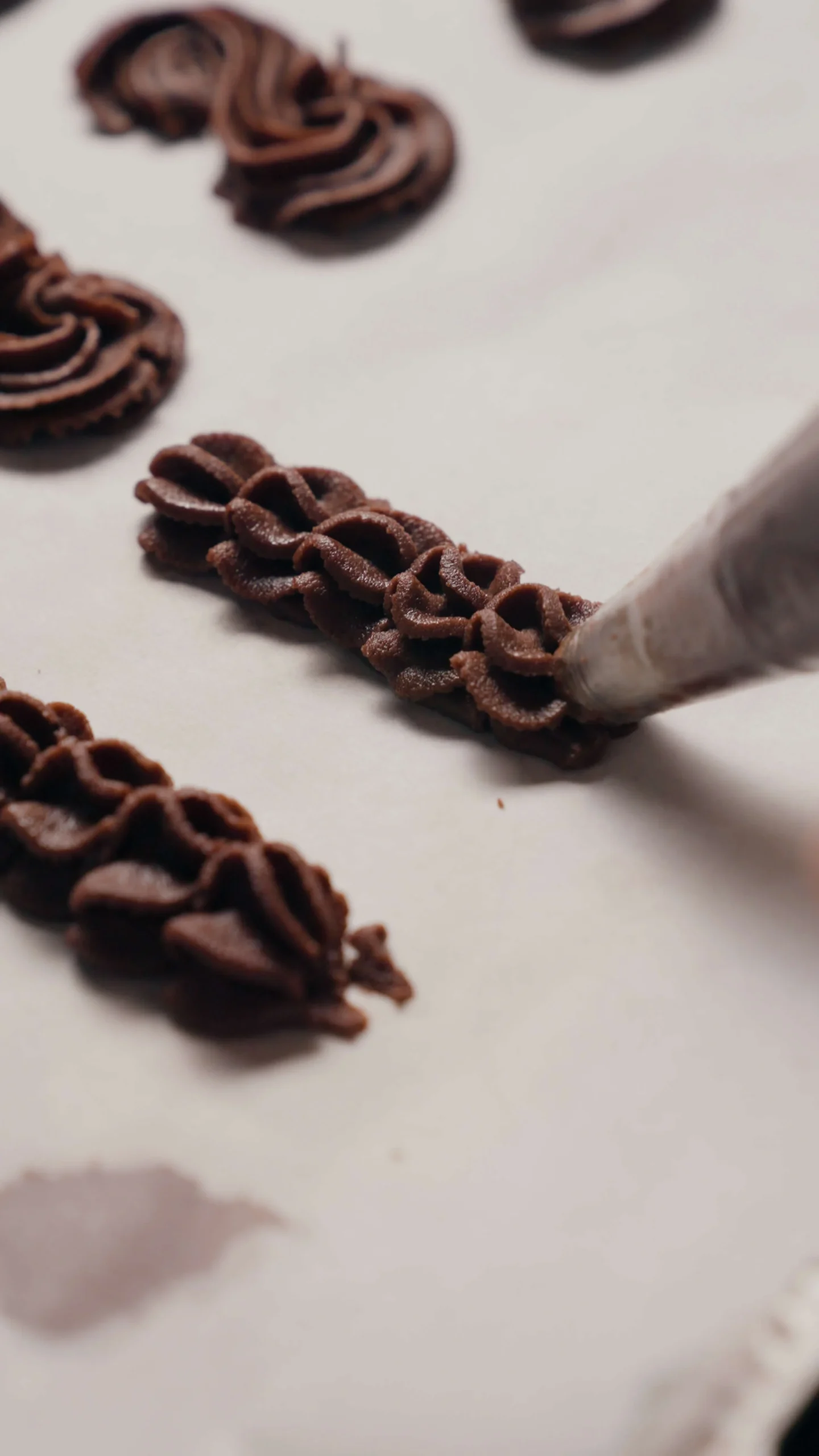 piping different shape of chocolate viennese whirl
